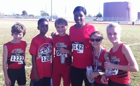 Coach Kenya Artis with Cross Country Athletes
